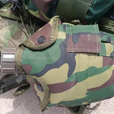 Military issued tactical load bearing vest with accessories.