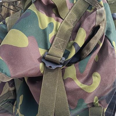 Military issued tactical load bearing vest with accessories.