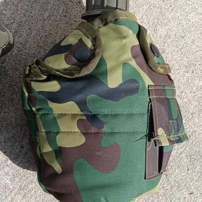 Vector pack systems camo canvas bag with camouflage hat and pouch and canteen.