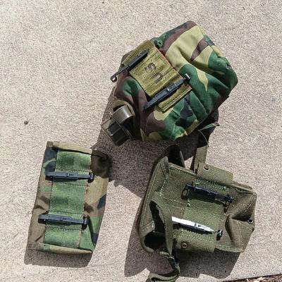 Vector pack systems camo canvas bag with camouflage hat and pouch and canteen.