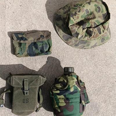 Vector pack systems camo canvas bag with camouflage hat and pouch and canteen.