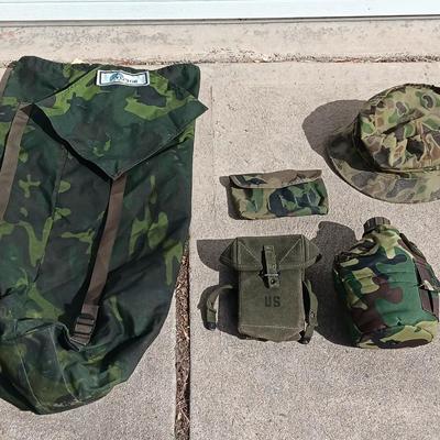 Vector pack systems camo canvas bag with camouflage hat and pouch and canteen.