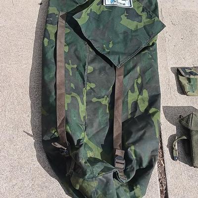 Vector pack systems camo canvas bag with camouflage hat and pouch and canteen.