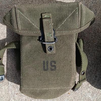 Vector pack systems camo canvas bag with camouflage hat and pouch and canteen.