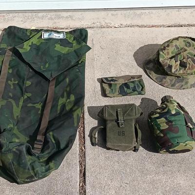Vector pack systems camo canvas bag with camouflage hat and pouch and canteen.