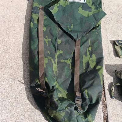 Vector pack systems camo canvas bag with camouflage hat and pouch and canteen.