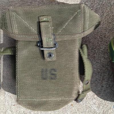 Vector pack systems camo canvas bag with camouflage hat and pouch and canteen.