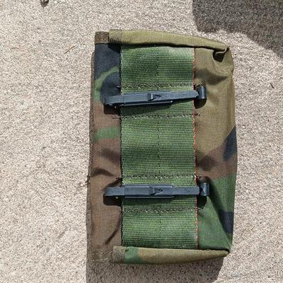 Vector pack systems camo canvas bag with camouflage hat and pouch and canteen.