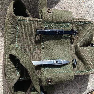 Vector pack systems camo canvas bag with camouflage hat and pouch and canteen.