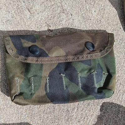 Vector pack systems camo canvas bag with camouflage hat and pouch and canteen.
