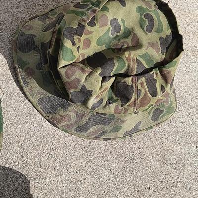 Vector pack systems camo canvas bag with camouflage hat and pouch and canteen.