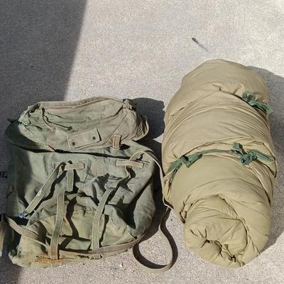 Green Military canvas backpack with US Military Mountain down sleeping bag