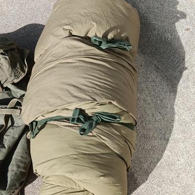 Green Military canvas backpack with US Military Mountain down sleeping bag
