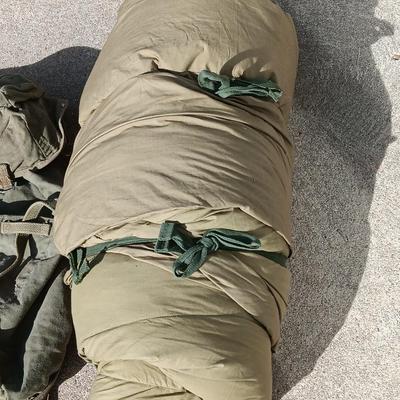 Green Military canvas backpack with US Military Mountain down sleeping bag