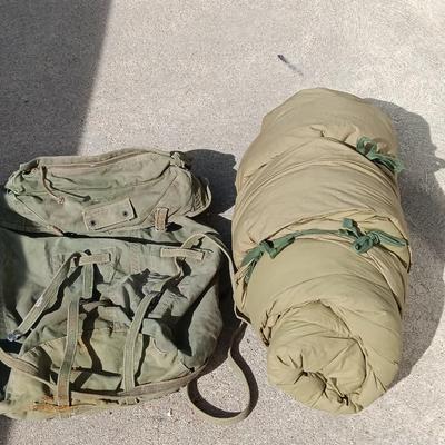 Green Military canvas backpack with US Military Mountain down sleeping bag