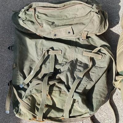 Green Military canvas backpack with US Military Mountain down sleeping bag