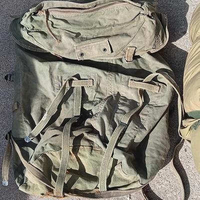 Green Military canvas backpack with US Military Mountain down sleeping bag