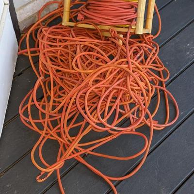 Pile of extension cords and reel