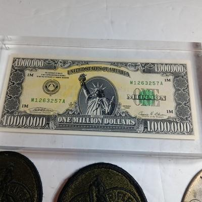 Variety of items - Million-dollar bill - Military patches - Bumper stickers -