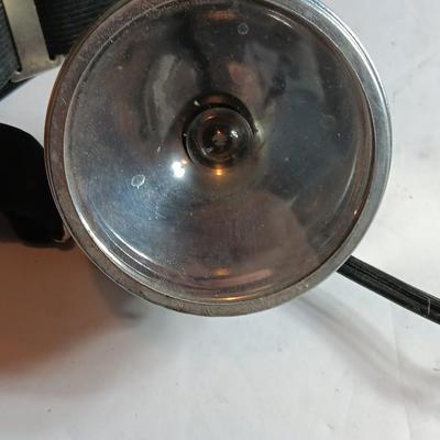 Orange security warning flasher / siren light with vintage metal battery operated head lamp and flashlight.