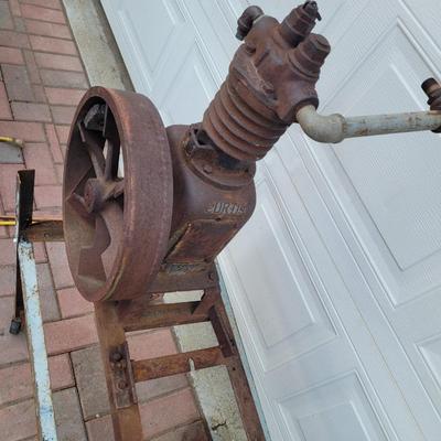Antiques Curtis compressor on stand with wheels.