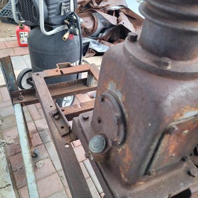 Antiques Curtis compressor on stand with wheels.