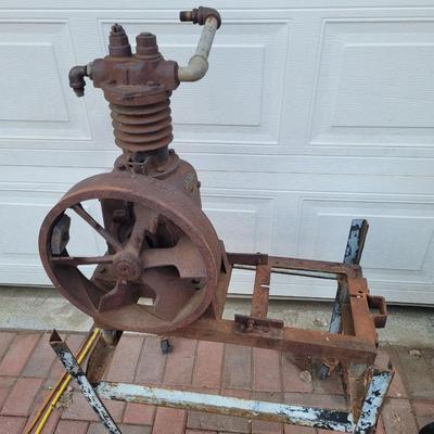 Antiques Curtis compressor on stand with wheels.