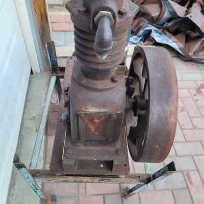 Antiques Curtis compressor on stand with wheels.