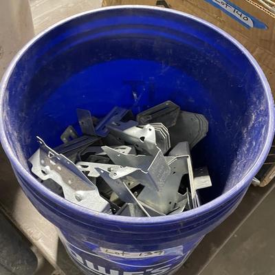 Bucket of long metal joist hangars