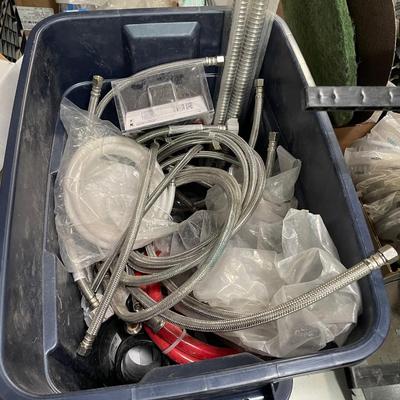 Tub full of flexible fawcett hoses & other plumbing components