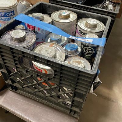 Crate of PVC pipe adhesives - maybe 20 cans