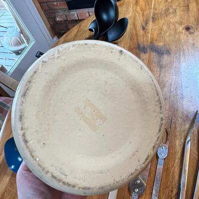 Crock jar of utensils