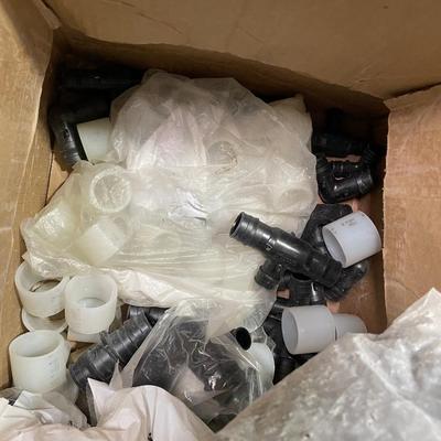 Box of Plastic flex hose connectors/plumbing fixture pieces