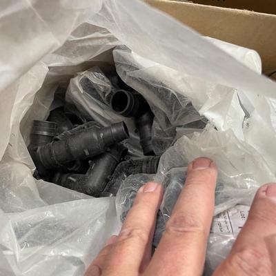 Box of Plastic flex hose connectors/plumbing fixture pieces