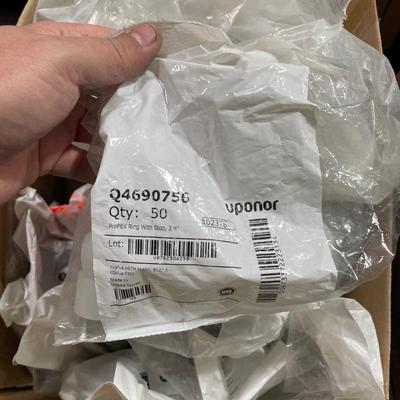 Box of Plastic flex hose connectors/plumbing fixture pieces