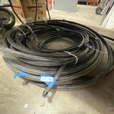2-3 Rolls of long flexible insulated hose - looks like metal conduit on the inside