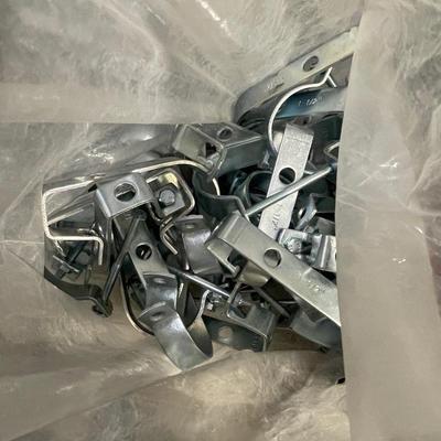 Box of Metal Clamps - maybe for fence or plumbing use