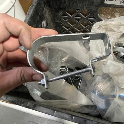 Crate of metal clamps