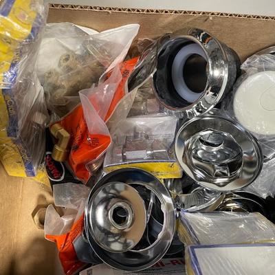 Box of Plumbing Fixtures Supplies/toilet bowl rings/fawcett valves/wall covers