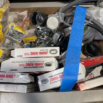 Box of Plumbing Fixtures Supplies/toilet bowl rings/fawcett valves/wall covers