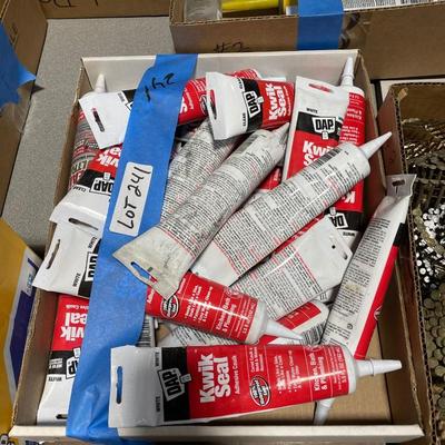 Box of many tubes Dap Kwik Seal Adhesive Caulking