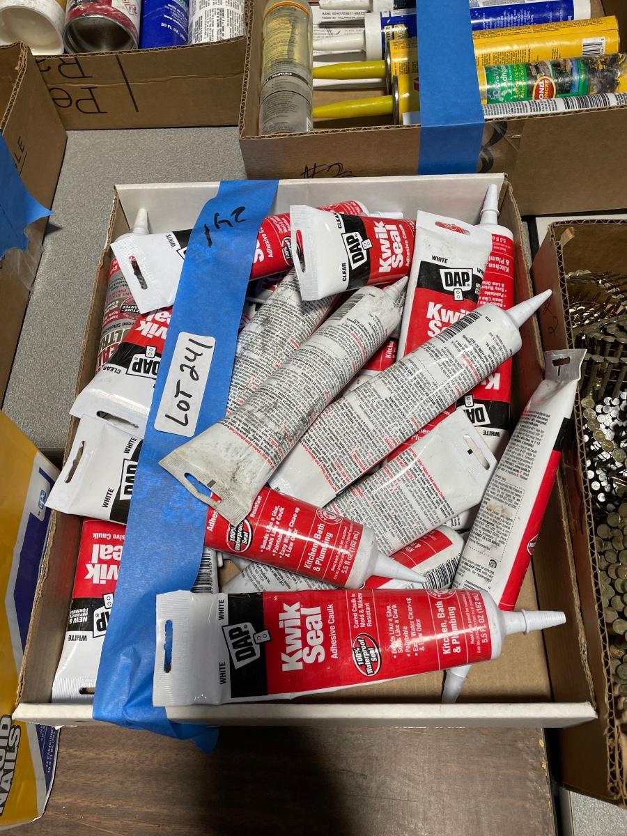 Box of many tubes Dap Kwik Seal Adhesive Caulking