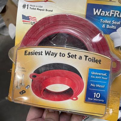 Box of Plumbing Supplies - Toilet Rings, sink components