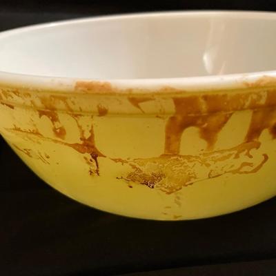Large yellow Pyrex bowl with plate and silver bowl