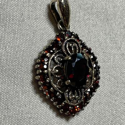 CAN Thai Sterling Pendant with Garnets