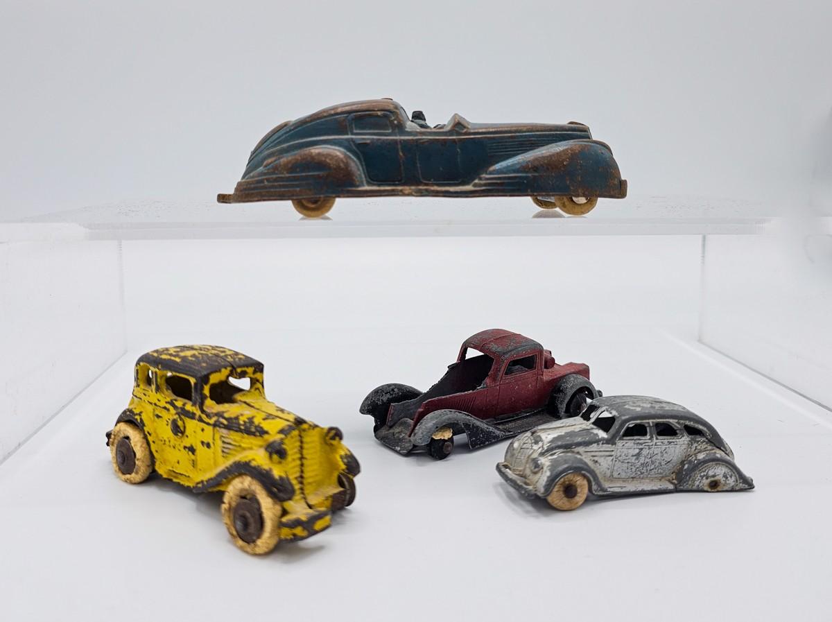 Four Antique Diecast Cars EstateSales org