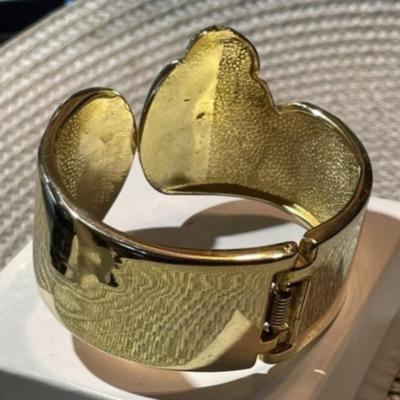 Ladies Hinged Gold-tone Color Sea Lion Fashion Spring Loaded Cuff Bracelet 1"-1.5" in VG Preowned Condition.