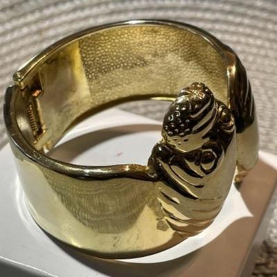 Ladies Hinged Gold-tone Color Sea Lion Fashion Spring Loaded Cuff Bracelet 1"-1.5" in VG Preowned Condition.