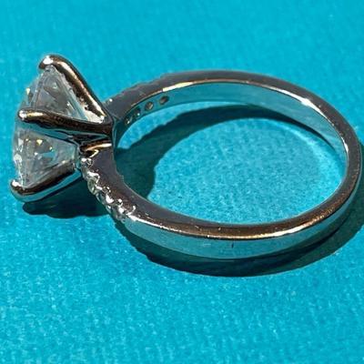 Vintage Silver-toned Fashion CZ Engagement Style Ring w/Center CZ Stone Measuring about 1.75 Carats in VG Preowned Condition.