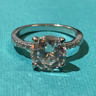 Vintage Silver-toned Fashion CZ Engagement Style Ring w/Center CZ Stone Measuring about 1.75 Carats in VG Preowned Condition.